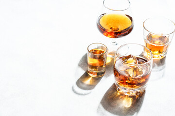 Strong alcohol drink. Cognac, whisky, rum, tequila at white background.