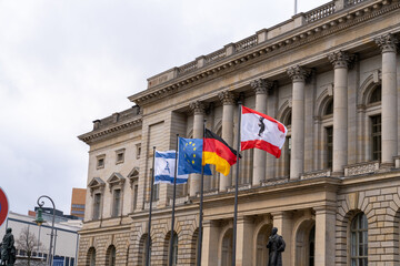 A building with flags on the top of it