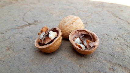 Walnuts kernels opening Walnut on the ground closeup photo