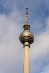 A tall tower with a red and white top