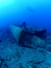 scuba divers exploring wrecks underwater wreck diving