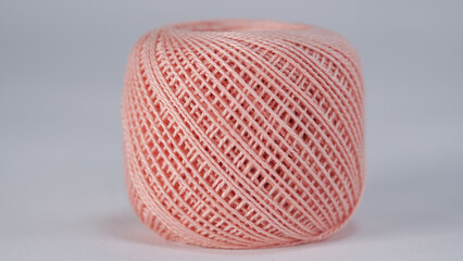 spool of thread for sewing on a white background close-up