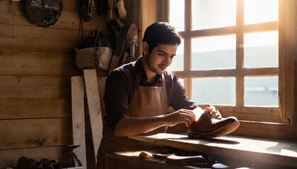 shoemaker working making comfortable shoes for women and men