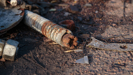 Obraz premium a rusty used spare part of a truck lies on the ground
