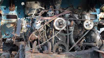 Enlarged view of the truck engine. pipes, pulleys, gears, alternator and other motor equipment. Old used car engine