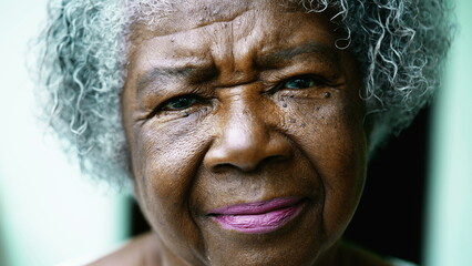 Close-Up of Gray-Haired African American Lady with Wrinkled Face. Portrait of a black woman looking...