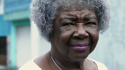 One pensive senior black lady with wrinkled face and gray hair. Portrait of an old African American...