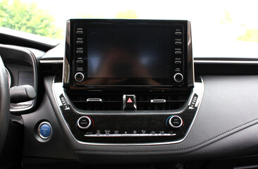 Modern car Screen multimedia system. Panel of a modern car. Interior of a modern luxury car.  Modern car dashboard.