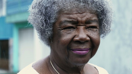 One pensive senior black lady with wrinkled face and gray hair. Portrait of an old African American...
