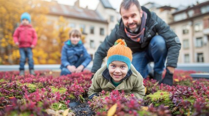 Happy family having fun in autumn on the green roof of their eco-friendly house in the city - 753061578
