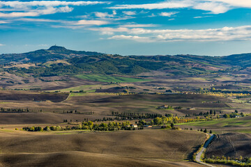 Elevated landscape with fields and hills, autumn late afternoon, high angle view from Pienza,...