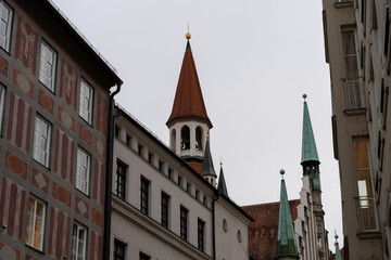 A row of buildings with a tall tower in the middle