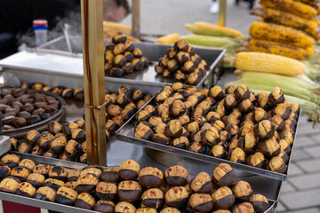A table full of food, including corn and potato chips