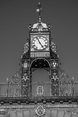 Eastgate Clock, 1897 victorian gate through the Chester city walls, on the site of the original entrance to the Roman fortress of Deva Victrix in Chester, Cheshire, England, UK in black and white - 753071135