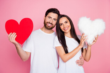 Photo portrait of lovely young couple hold big red heart fluffy pillow dressed stylish white garment isolated on pink color background