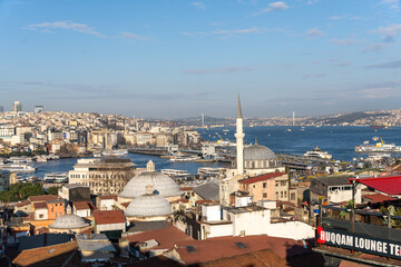 A city view with a red sign that says 