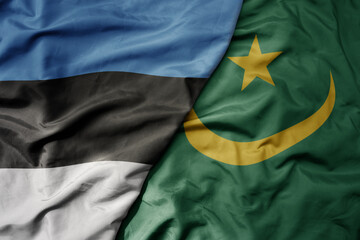 big waving national colorful flag of mauritania and national flag of estonia.