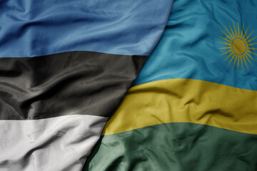 big waving national colorful flag of rwanda and national flag of estonia.