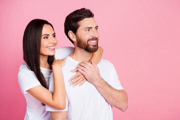 Photo portrait of lovely young couple hugging look empty space dressed stylish white garment isolated on pink color background