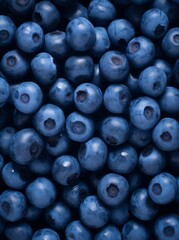 Blueberry Abundance: A Close-Up View of Juicy Berries in Moody Blue Tones