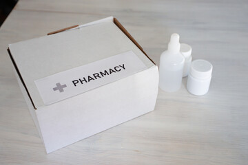 Medicine purchase, pills in a box in home interior , online healthcare, pharmaceutical order