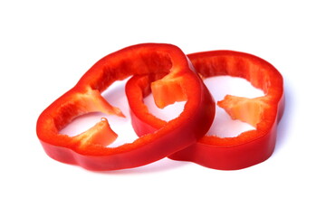 Sliced red bell pepper lies on a white background.	