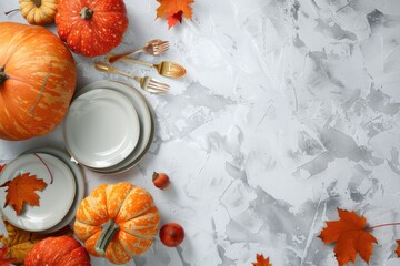 Thanksgiving festive table composition with different colourful pumpkins, autumn leaves, empty plates with cutlery on light grey background table ready for party and celebration. - obrazy, fototapety, plakaty