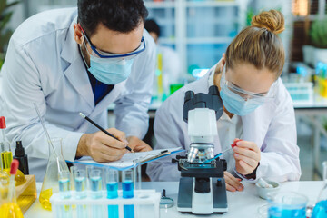 Scientist and people in science exam, test or group project in experiment or assignment at laboratory. Scientist or pharmacist work in scientific lab. Medical Development Laboratory.