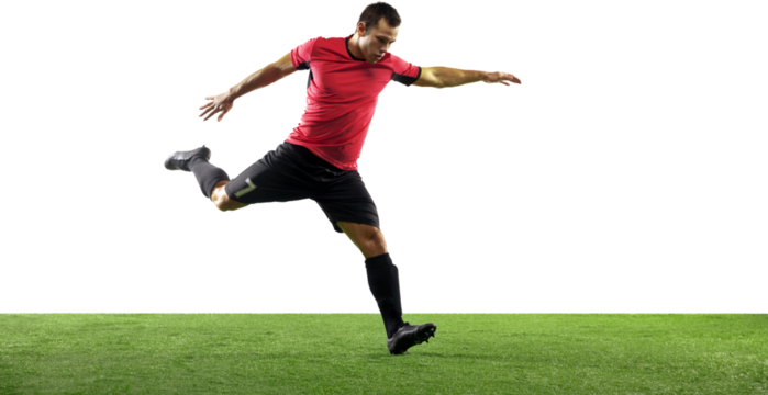 Young guy, soccer player in motion with ball training isolated on transparent background with grass flooring. Concept of sport, game, competition, active lifestyle. Banner. Empty space to insert text