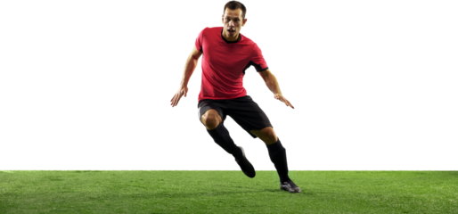 Young man in black uniform, football player playing, dribbling ball isolated on transparent background. Concept of sport, game, competition, championship, active lifestyle, tournament