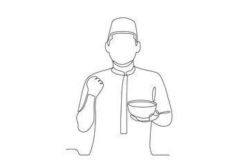 A man breaks his fast with porridge