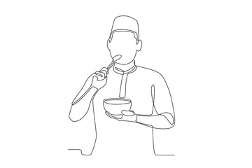 A man is eating porridge