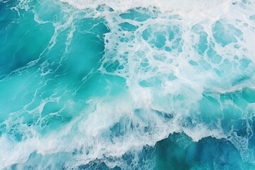 Blue ocean waves with foam, summer background, top view.