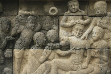 The relief or carvings on the walls of Borobudur Temple.