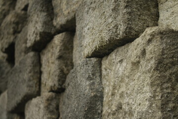 The intricate patterns of old stone walls in a temple.