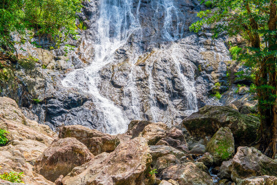 Sarika Waterfall, Khao Yai National Park, Thailand. rock layers arranged Surrounded by trees, it looks natural and beautiful. In the daytime there is a pale yellow sun.