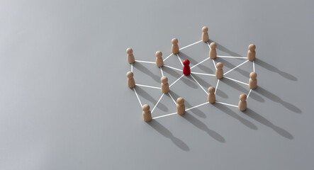 Connecting people, partnership, social media networks concept on gray background using wood block...