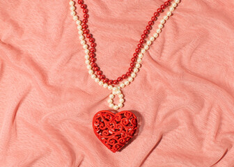 Necklace made of red and white strings of beads, big romantic heart as a pendant, creative...
