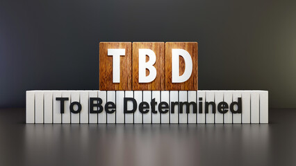 TBD - To Be Determined
on wooden cube, black background