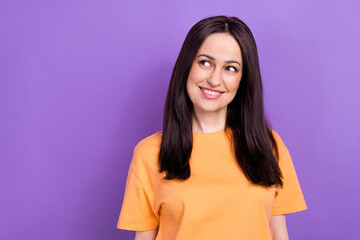 Photo of cute woman with straight hairstyle dressed orange t-shirt look at proposition empty space...