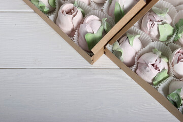 Marshmallows in gift boxes. Marshmallow flowers. Homemade marshmallows. Close-up.