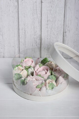 Marshmallows in hatboxes. Marshmallow flowers. Homemade marshmallows. A white hatbox. The box is open.