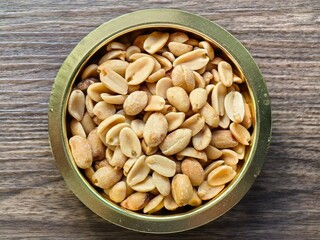 Plain peanuts in a golden bowl