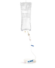 IV fluid kit with gravity drip for home care administration. Medical supplies used for prescribed rehydration for cats, dogs, pets or human. Selective focus. White background.