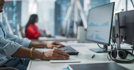 Close Up of a Young Indian Male Professional Working in a Business Research and Development...