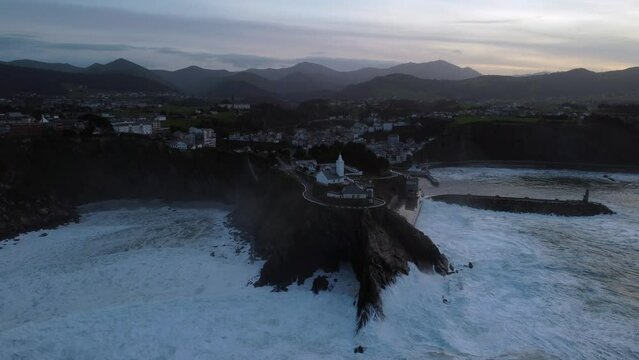 Aerial view of Luarca in Asturias from the sea at night. Spain.