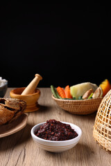 pork shrimp chilli dip local thai food sauce isolated in wood background