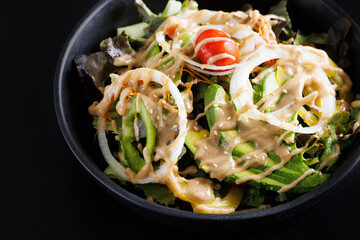 Japanese salad isolated in black background