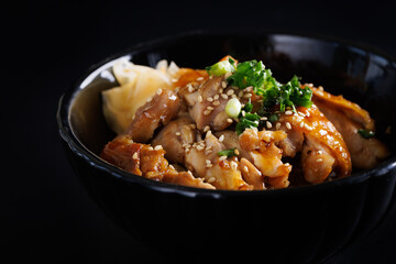 Grilled Chicken teriyaki rice Japanese food isolated in black background