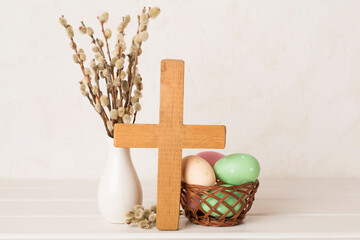 Fototapeta na wymiar Easter eggs with cross on wooden background